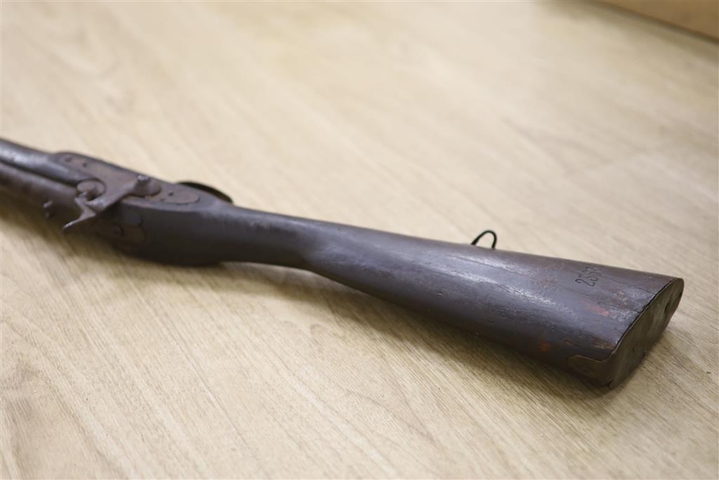 A walnut percussion rifle with ram rod